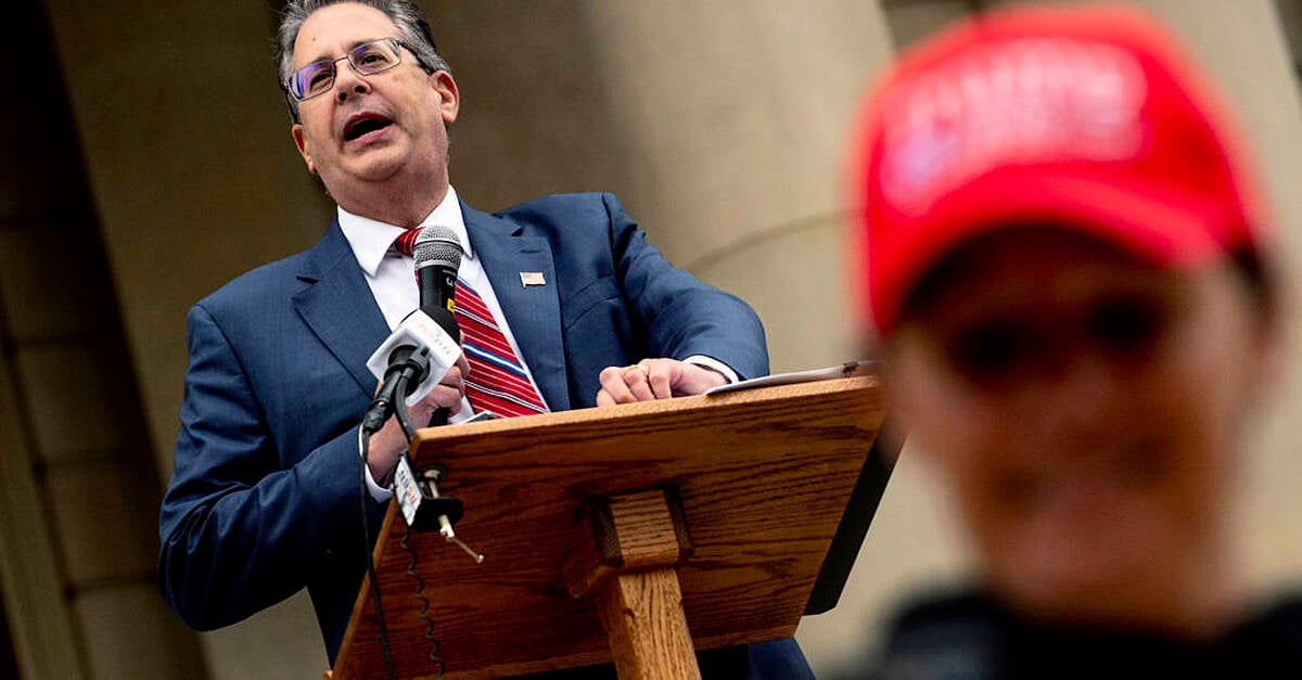 Michigan prosecutors charge Trump allies with vote machine tampering
