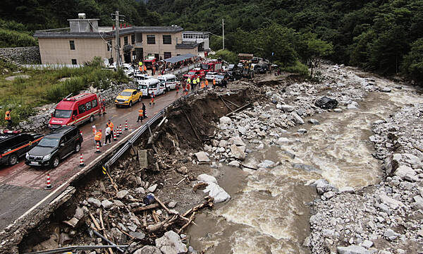 China Residents Evacuated From Homes Amid Search For More Mudslide Victims