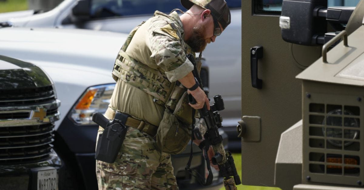 Residents stay indoors and schools close as US police close in on armed fugitive
