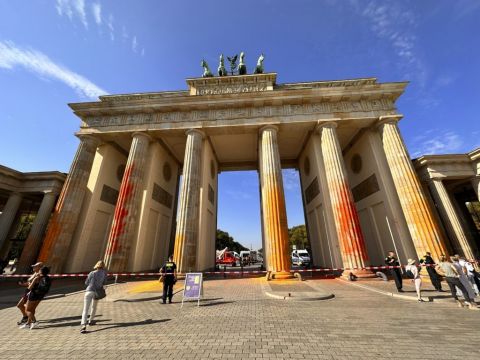 Climate Activists Spray Berlin’s Brandenburg Gate With Orange Paint