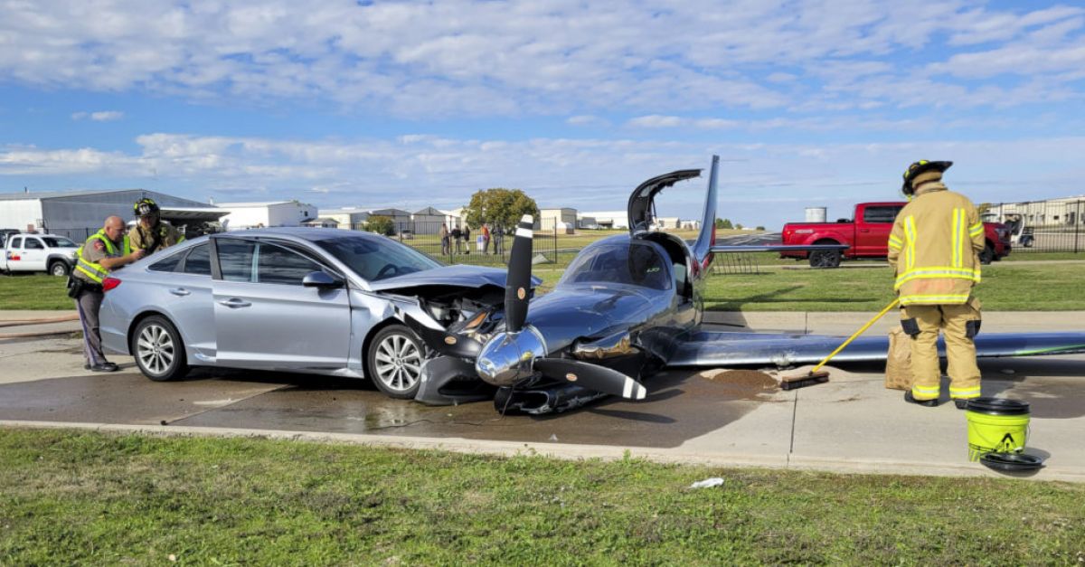 Small plane crashes into car after overshooting runway during emergency landing