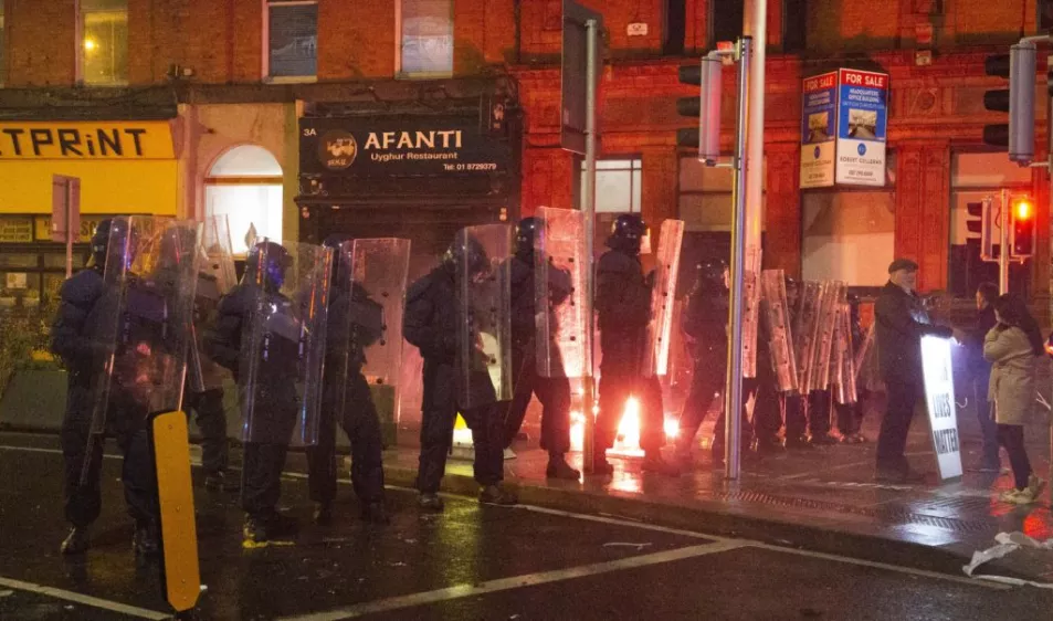 Protesters set Garda car on fire near scene of Dublin knife attack