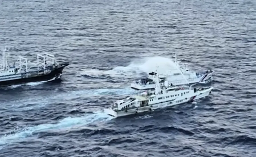 Chinese Coast Guard Ships Blast Philippine Vessels With Water Cannon