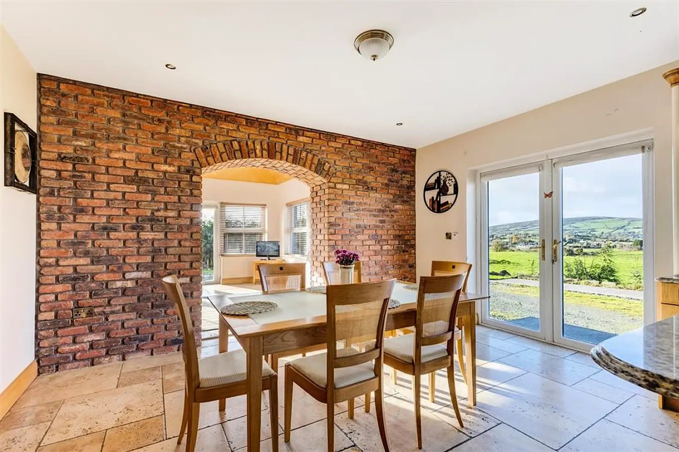 Dining Area Showing Archway To Sunroom