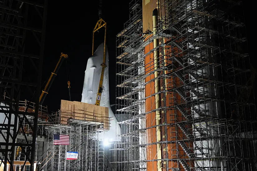 Retired Shuttle Endeavour Is Hoisted Into Launch Position At New Museum