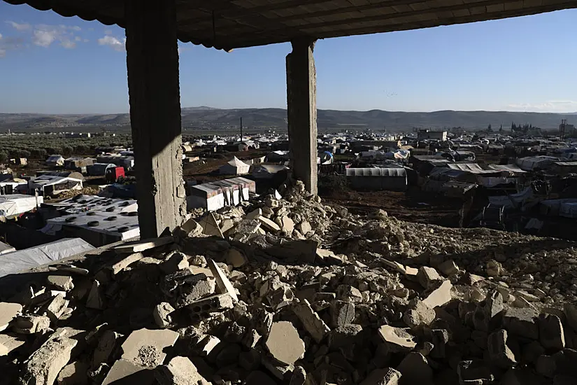 Syrians Endure Winter In Muddy Tents Surrounded By Quake Damage One Year On