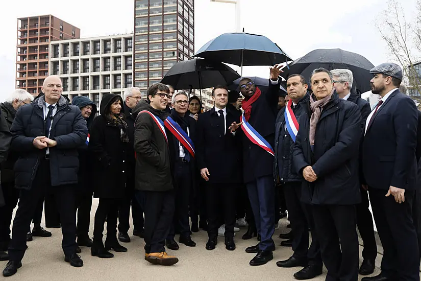 Macron Vows To Swim In Cleaned-Up Seine During Tour Of Olympic Village