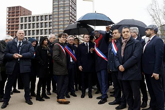 Macron Vows To Swim In Cleaned-Up Seine During Tour Of Olympic Village