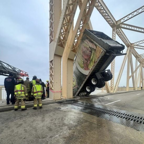 Driver Rescued After Crash Leaves Lorry Dangling Over Side Of Bridge In Us