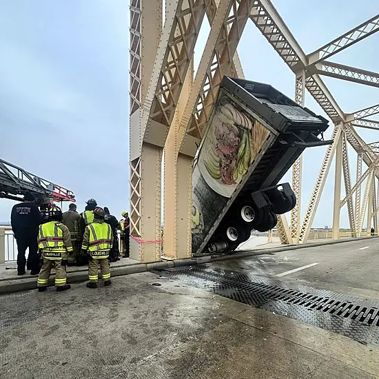 Driver Rescued After Crash Leaves Lorry Dangling Over Side Of Bridge In Us