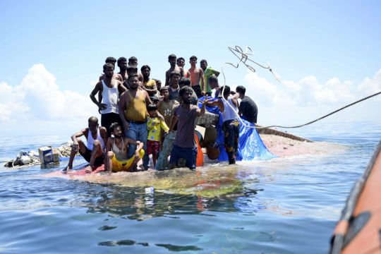 Dozens Of Refugees Rescued In Indonesia After Night On Hull Of Capsized Boat