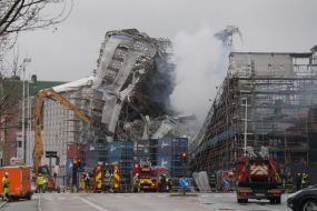Firefighters Tackle Scaffolding Dangling Outside Fire-Ravaged Danish Landmark