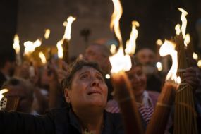 Orthodox Worshippers Greet Ancient Ceremony Of The Holy Fire In Jerusalem