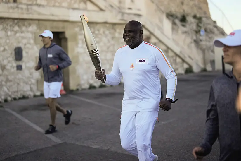 Torchbearers In Marseille Kick Off Olympic Flame’s Journey Across France