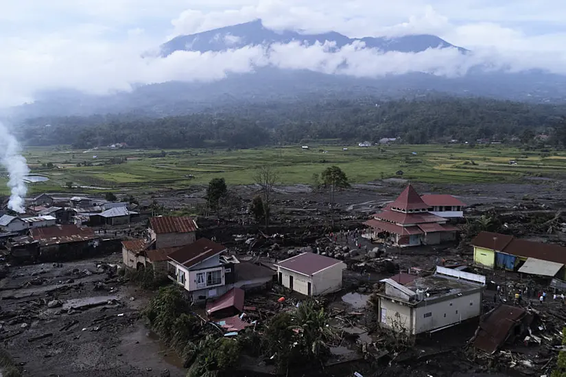 Indonesian Rescuers Search Through Rivers And Rubble After Flash Floods