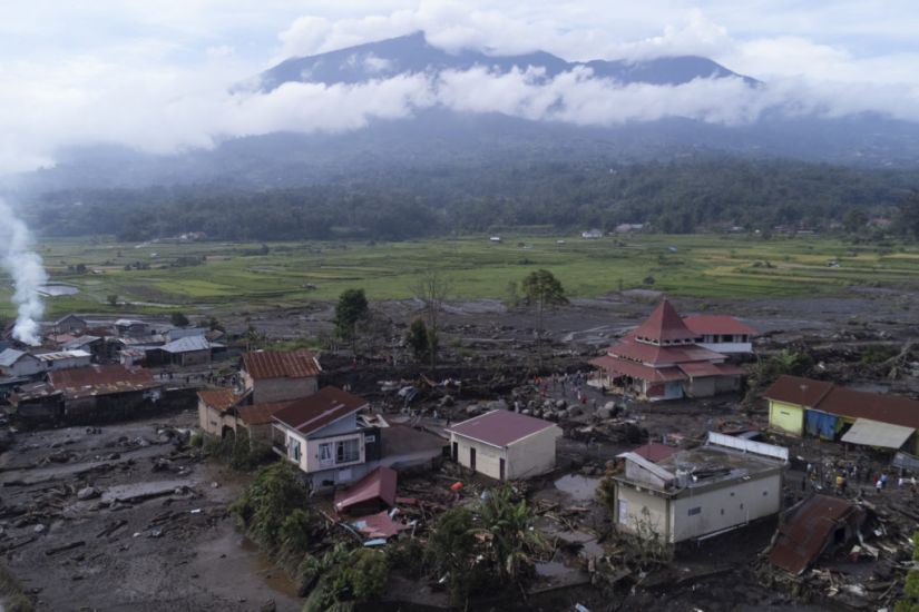 Indonesian Rescuers Search Through Rivers And Rubble After Flash Floods