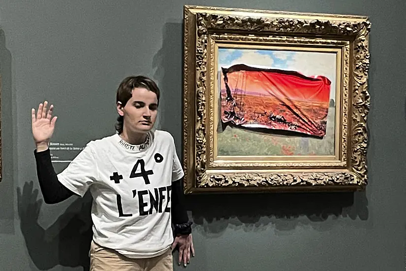 Climate Activist Sticks Protest Poster On Monet’s Poppy Field In Paris Museum