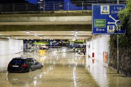 Clean-Up Begins After Sudden Storms Flood Roads And Halt Air Traffic In Geneva