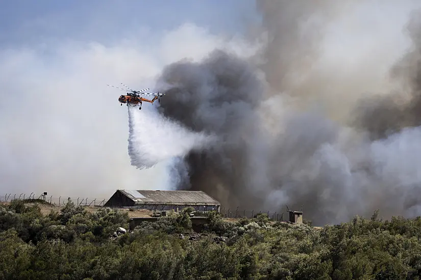 Firefighters Tackle Blazes On Greek Islands Of Chios And Kos