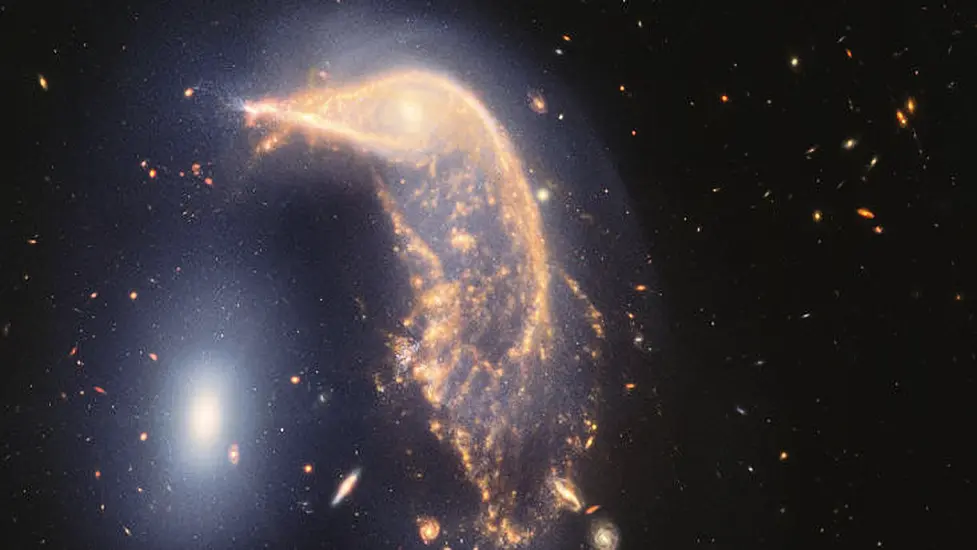 Webb Space Telescope’s Cosmic Shot Shows Intertwined Galaxies Glowing Infrared