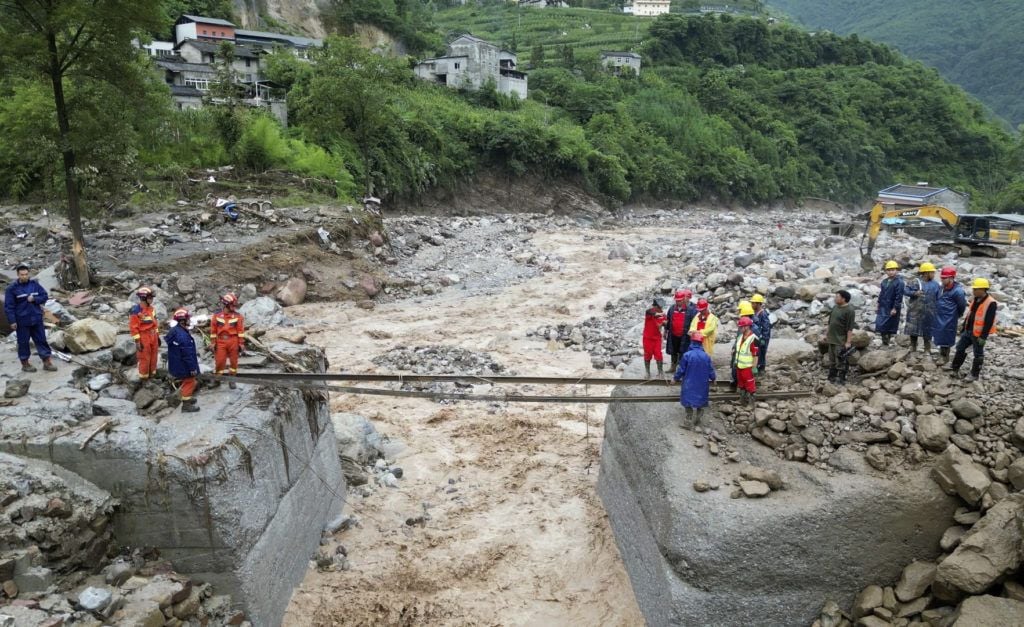 Search for missing after flooding and bridge collapse in China kill at least 25