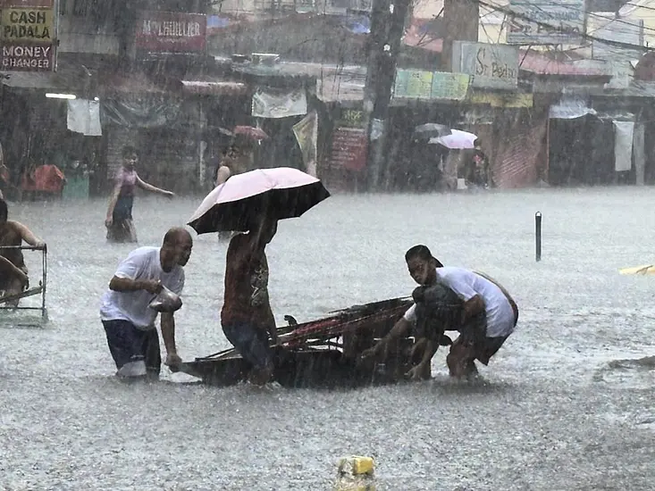 Taiwan Prepares For Strong Typhoon As Monsoon Rains Kill 13 In The Philippines