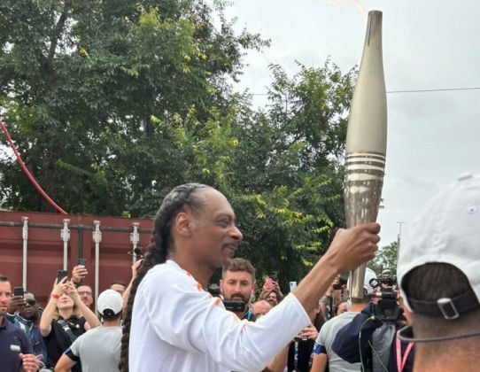 Crowds Cheer As Snoop Dogg Carries Olympic Torch For Paris 2024 Games
