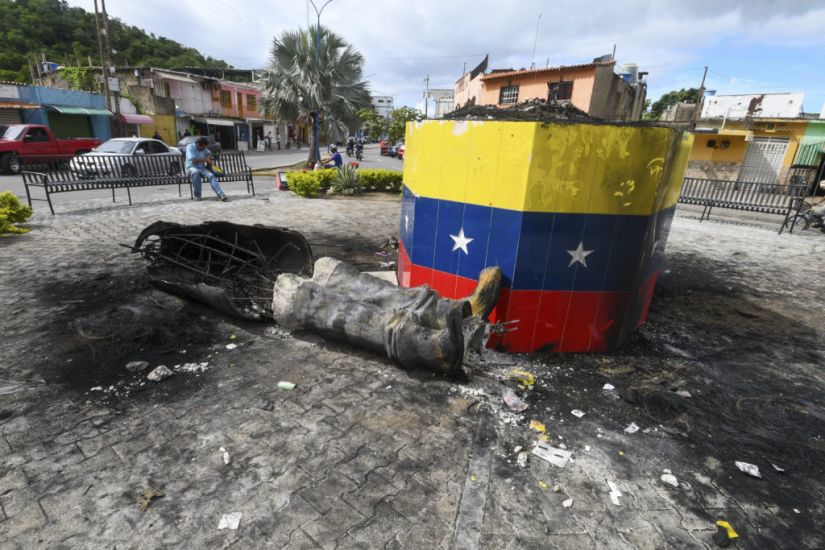 Hugo Chavez Statues Toppled Across Venezuela In Post-Election Unrest