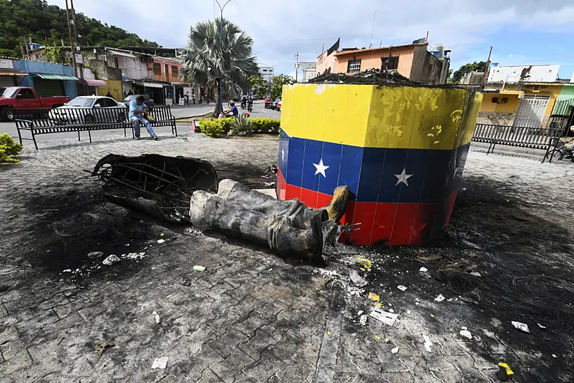 Hugo Chavez Statues Toppled Across Venezuela In Post-Election Unrest