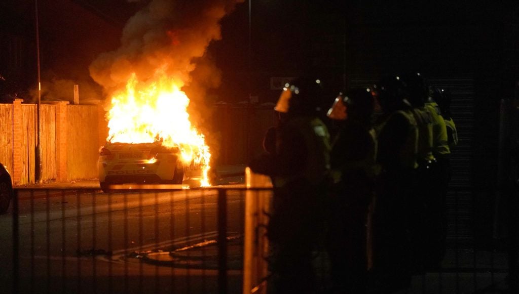 Seven men charged and a child arrested after violent unrest in UK