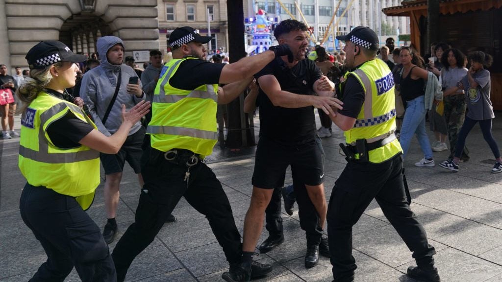 Dozens arrested as disorder continues in England, with fears of more violence to come
