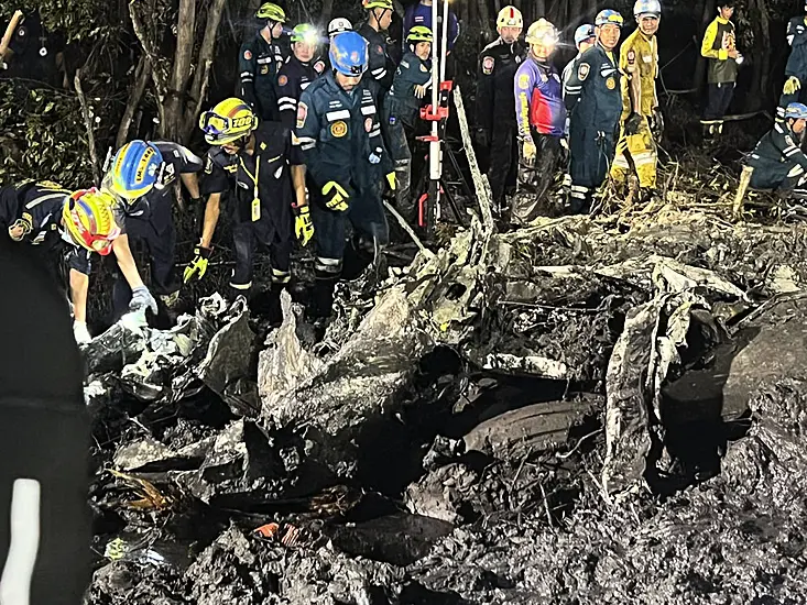 Searchers Dig In Muddy Swamp Where Tourist Plane Crashed Near Bangkok