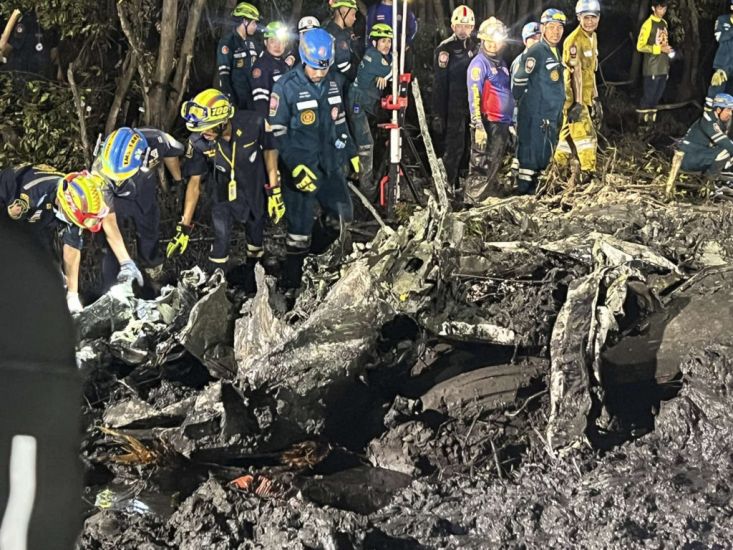 Searchers Dig In Muddy Swamp Where Tourist Plane Crashed Near Bangkok