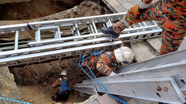 Woman Plunges Into 26Ft Hole After Pavement Collapses In Malaysian Capital