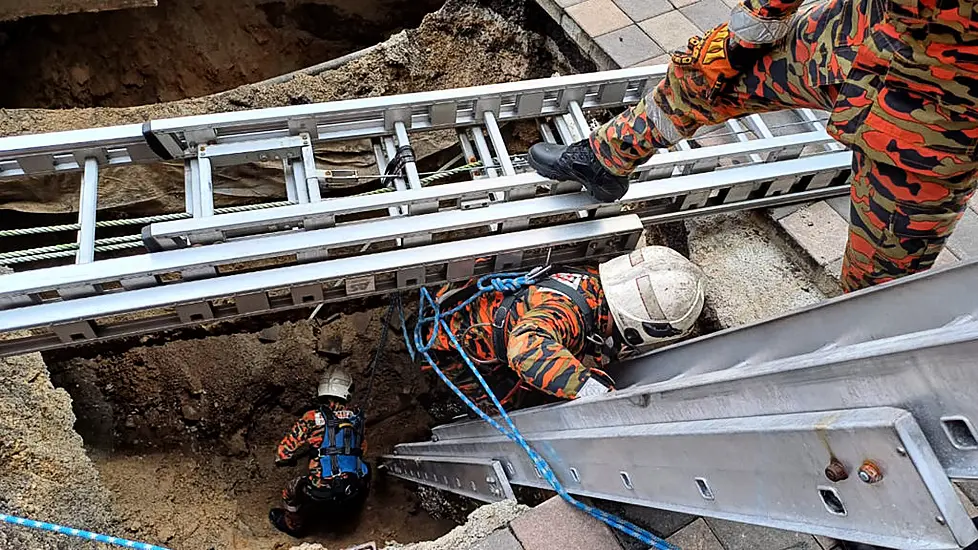 Woman Plunges Into 26Ft Hole After Pavement Collapses In Malaysian Capital