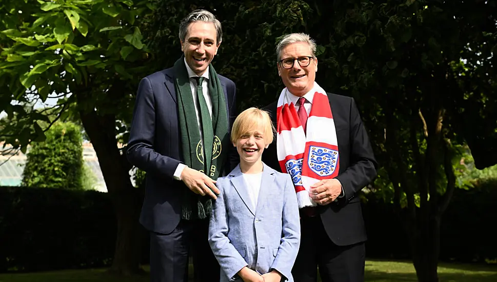 Dublin Boy Treated For Rare Illness Presents Harris And Starmer With Football Shirts