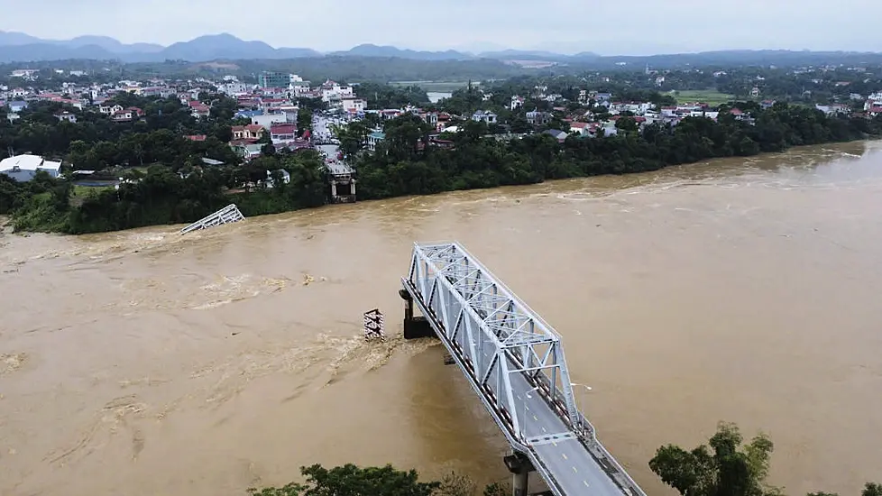 Bridge Collapses As More Rain Falls In Vietnam, Raising Storm Death Toll To 21