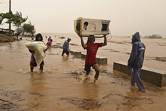 Typhoon Batters Storm-Weary Philippines And Displaces Thousands More People