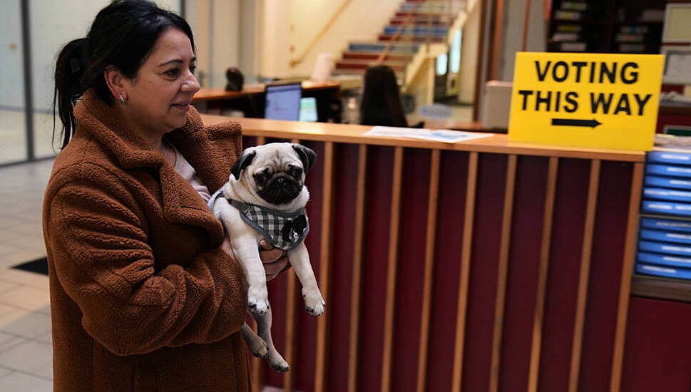 In Pictures: Voters And A Pug Cast Their Ballots In The General Election