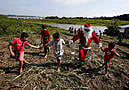 Santa Braves Sticky Heat Of Amazon Jungle To Bring Gifts To Children