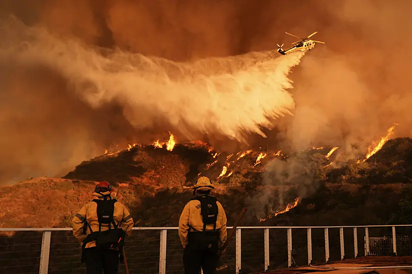 Firefighters Race To Contain La Wildfires As Menacing Winds Forecast To Return