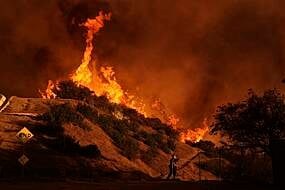 Fire Crews Scramble To Contain Los Angeles Blazes Before Winds Return