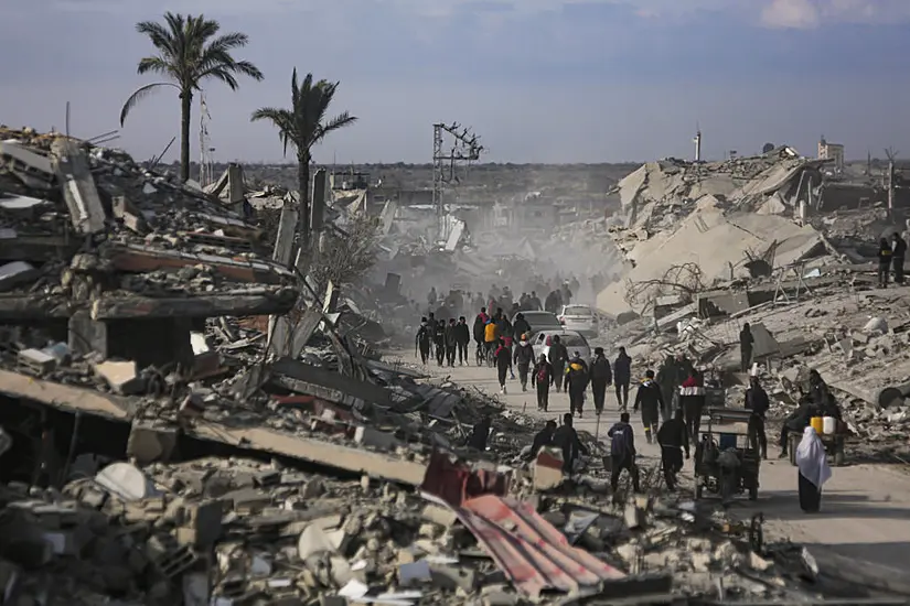 Palestinians Trek Across Rubble To Remains Of Homes As Ceasefire Takes Hold