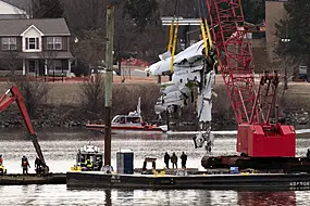 Crews Lift Pieces Of Crashed Airliner From River After Washington Air Disaster