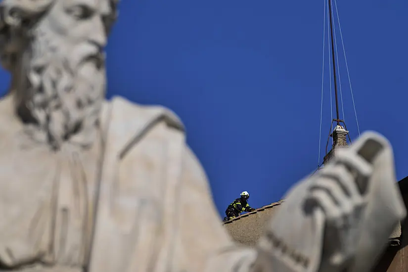Vatican Firefighters Install Chimney On Sistine Chapel Roof For Papal Election