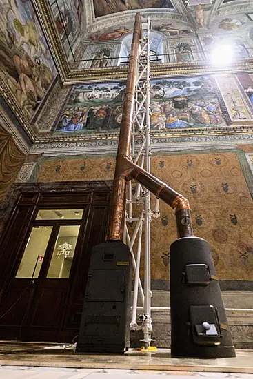 Vatican Workers Install Sistine Chapel Stove Ahead Of Conclave