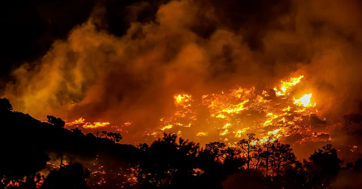 Firefighters race to contain wildfires in Greece as thousands evacuated