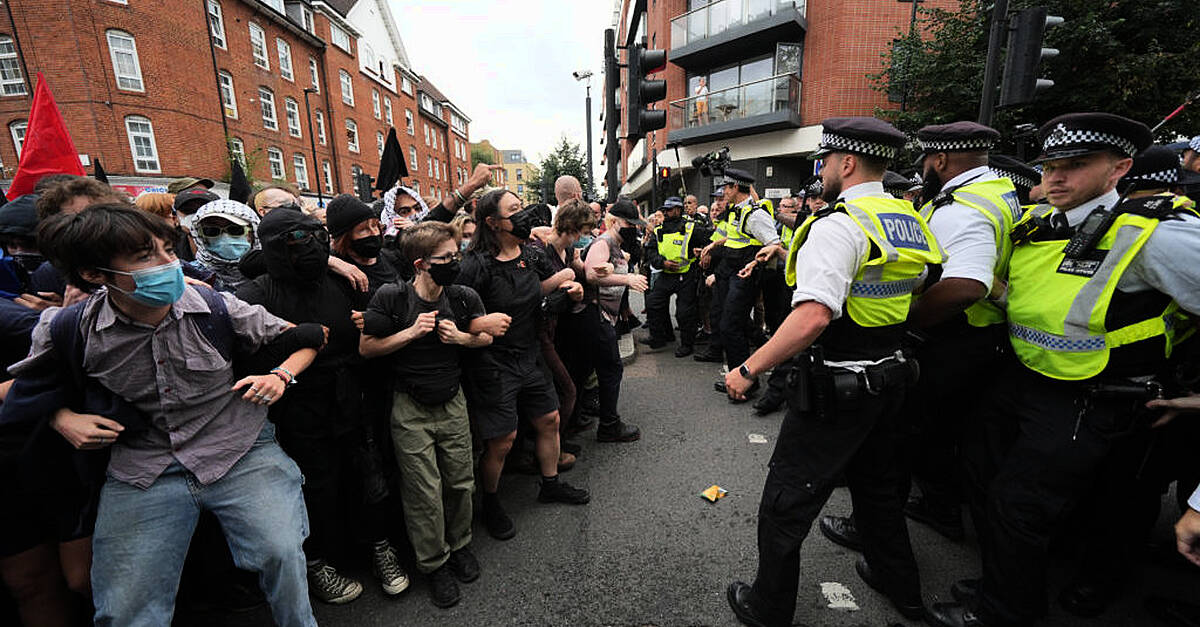 Demonstrators detained by police in London during rival protests outside asylum hotel