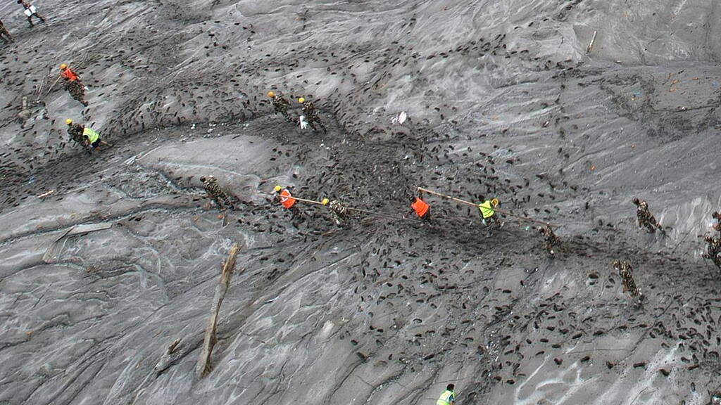 Mass burials in Nepal as death toll from flash floods exceeds 1,000