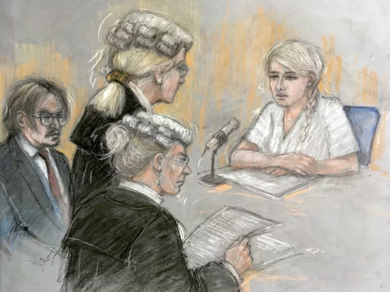 Amber Heard being cross examined by Eleanor Laws QC (Elizabeth Cook/PA)
